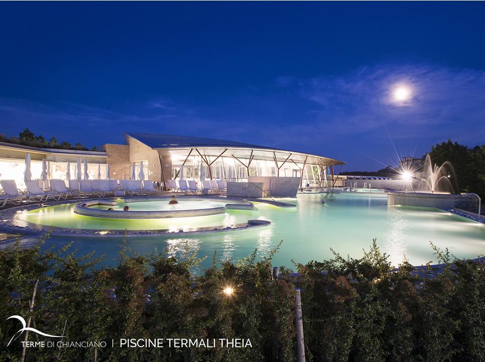 Theia thermal pools at night, with soft lighting and a relaxing atmosphere.